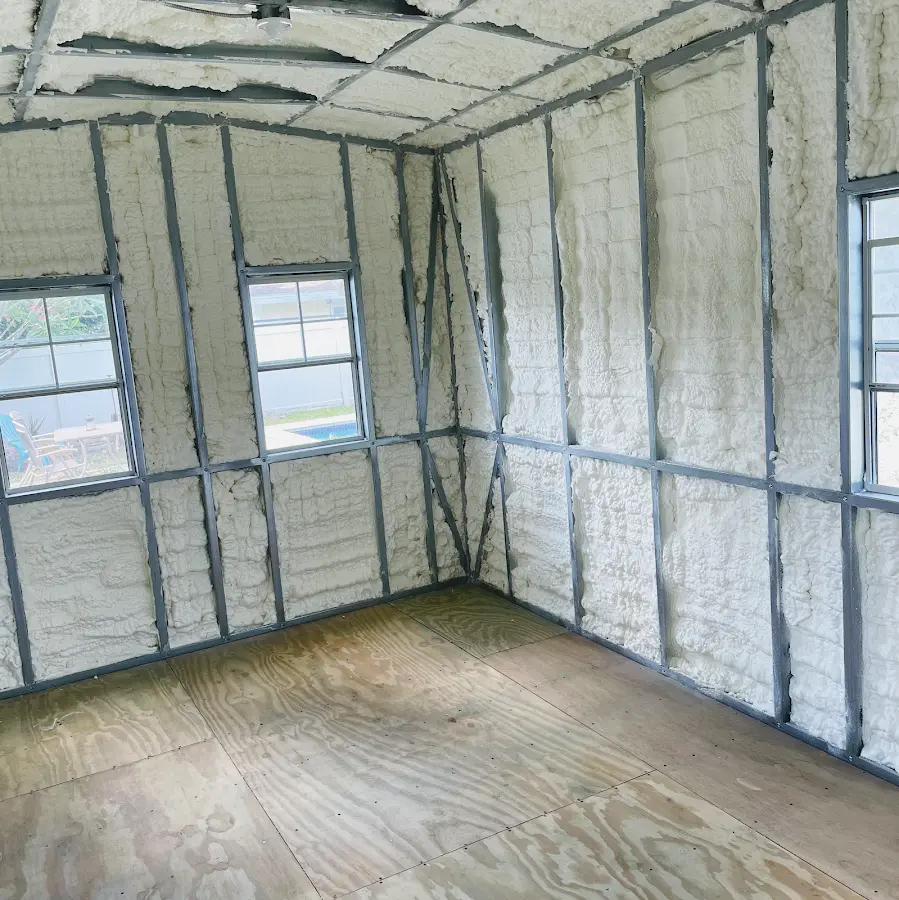 Closed-cell spray foam insulation applied to wall cavities in a residential project in Chickasaw